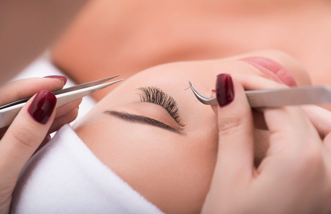 My favorite procedure. Close up of eyelash extension procedure in beauty salon for attractive woman